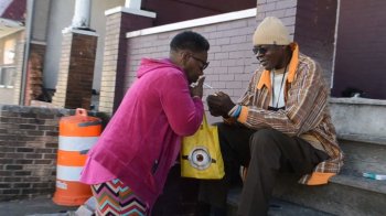Sharlene Adams bought one cigarette from a neighbor as she waited for a bus. Photo by Rachel Bluth/Capital News Service.